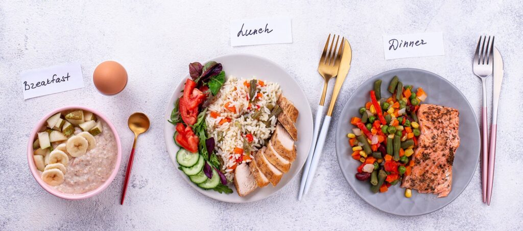 Plates of food for breakfast, lunch, and dinner showing nutritious options that can be incorporated into a GLP-1 meal plan