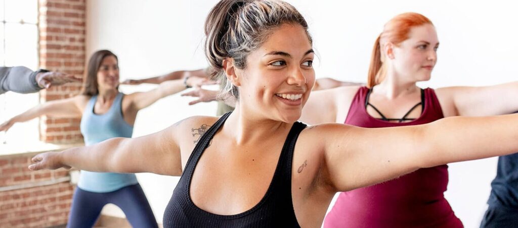 Ladies exercise in yoga class for overall wellness and weight loss while taking GLP-1 prescriptions supervised by an obesity medicine clinic