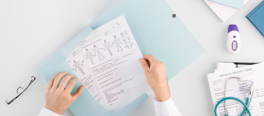 Obesity medicine doctor prepares a comprehensive medical history before prescribing a GLP-1 medication to a patient for medical weight loss